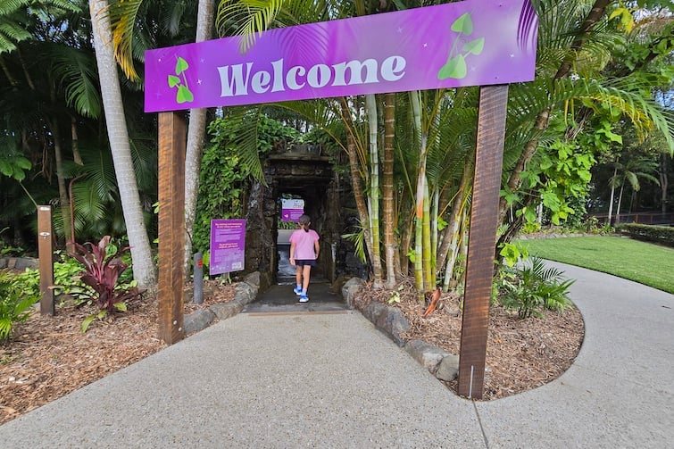 Welcome sign and waterfall at Amaze World.