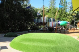 Grass mound and playground at Amaze World.