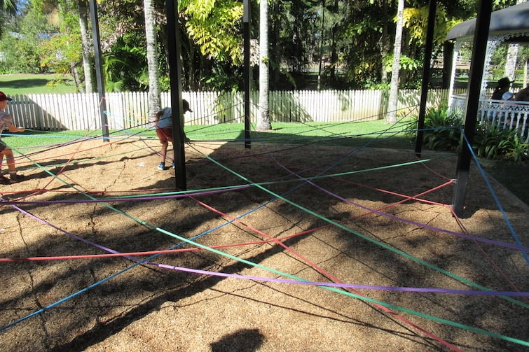 Child working through the rope maze at Amaze World.