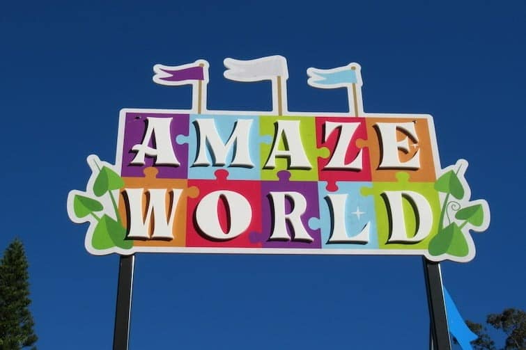Colourful Amaze World sign and blue skies.