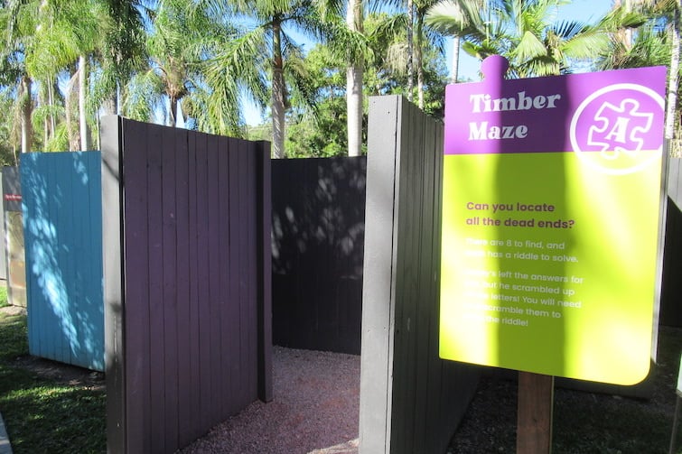 Timber maze entry sign at Amaze World.