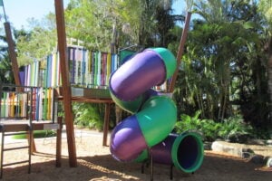 Colourful tunnel slide and playground at Amaze World.