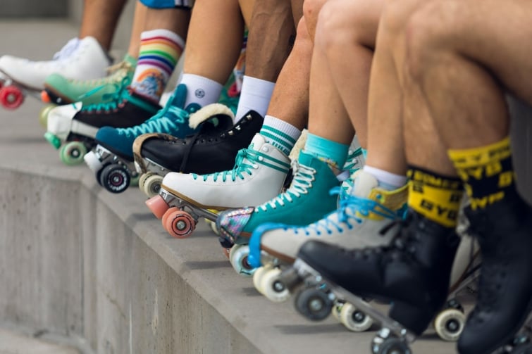 Roller Daze Brisbane Festival event image of lots of different coloured vintage roller skates and funky socks. 