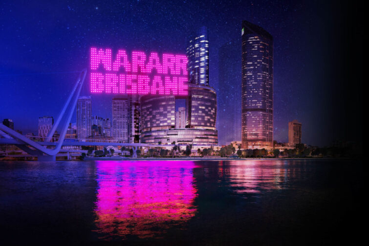 Nigeeroo spirit of the whale drone show as part of brisbane festival 2023 image of pink drones lighting up Brisbane city view over the river.