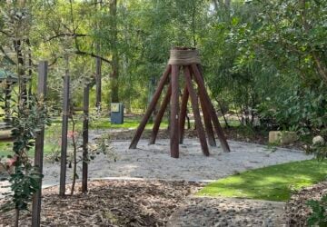 Wooden tepee and sensory play at Brosnan Drive Park.