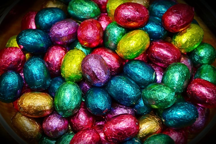 image of lots of chocolate easter eggs covered in multicolured foil.