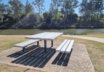 Picnic table by the river at Colleges Crossing.