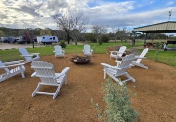 Communal fire pit area with seating at Country Style Holiday Park.