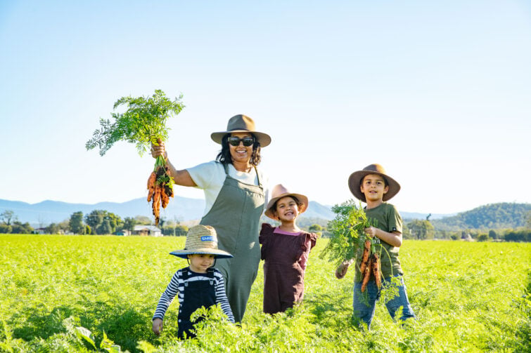 Est local month event mage of family in the carrot fields.