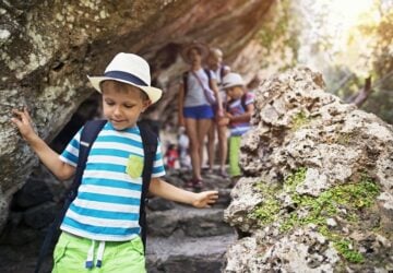 Little boy and his family hiking in Majorca mountains