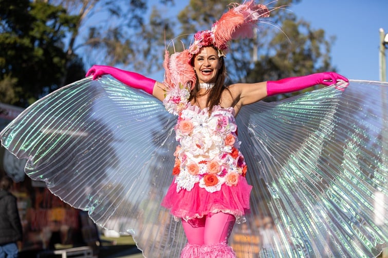 Hills Carnivale event image of stilt walker with wings.