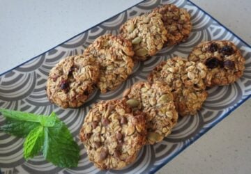 Baked cookies on a plate with a sprig of mint