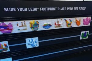 Dinosaur footprints made of LEGO displayed on the wall at Jurassic World by Brickman.