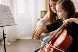 child playing cello listed under kids classes brisbane