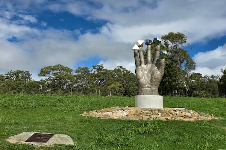 The Hand of Plato sculpture on the grounds of The Mathema Gallery.