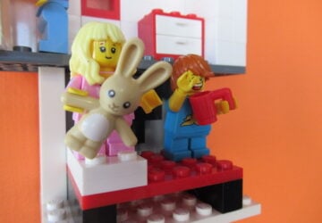 Lego mini figure holding bunny at Coffee n Bricks Cafe.