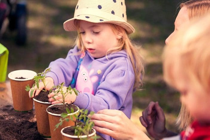 Girl planting carrots at Regional Flavours