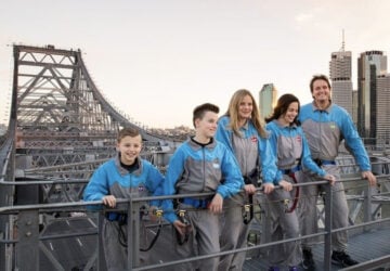 Story Bridge Adventure Climb smiling family of five on top of bridge.