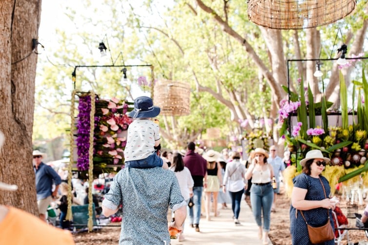 Toowoomba Carnival of Flowers people walking around outdoor market.