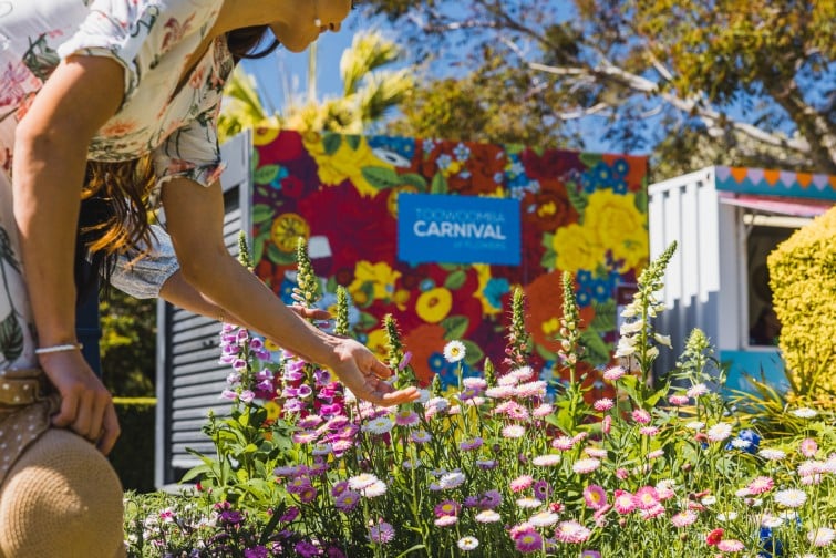 Toowoomba Carnival of Flowers woman admiring flower garden.