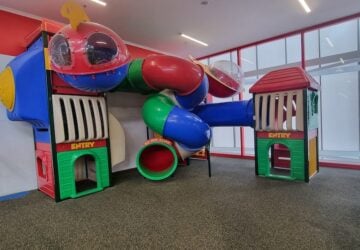 Colourful playground with tunnel slide at Bunnings.